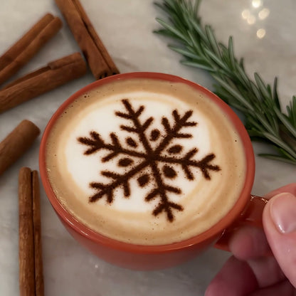 Snowflake design printed in cocoa on a cappuccino